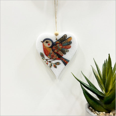 Elegant heart-shaped bird ornament with open wings, crafted from satin acrylic for home decor or gifting.