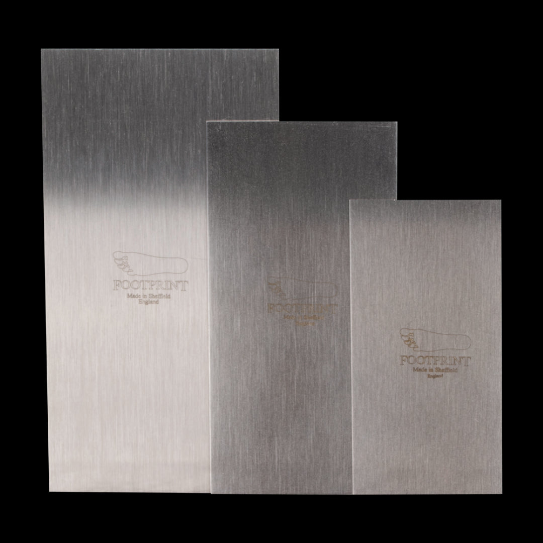 Set of three Footprint Cabinet Scrapers, high carbon steel, designed for precise wood finishing and shaping.