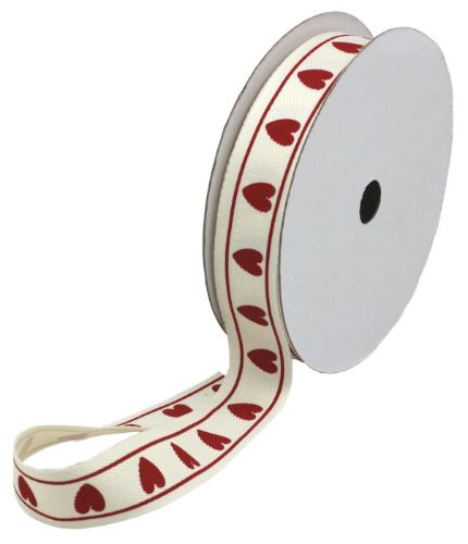 Cotton herringbone ribbon featuring a heart print, ideal for crafting and gift-wrapping, 25mm wide and 20m long.