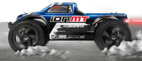 1/18 Ion MT Monster RC car featuring 4WD, MM-28 motor, waterproof receiver, and stylish gold-colored shocks.