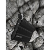 Samsung T7 Shield 4TB Portable SSD in black, rugged, IP65-rated, with fast USB 3.2 Gen 2 connectivity and drop resistance.