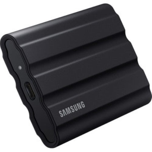 Samsung T7 Shield 4TB Portable SSD in black, featuring rugged design, IP65 water/dust resistance, and fast USB 3.2 Gen 2 speeds.