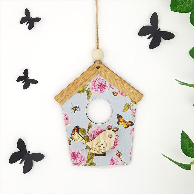 Whimsical blue-spotted birdhouse wall art crafted from laser-cut pine and MDF, perfect for adding charm to any decor.