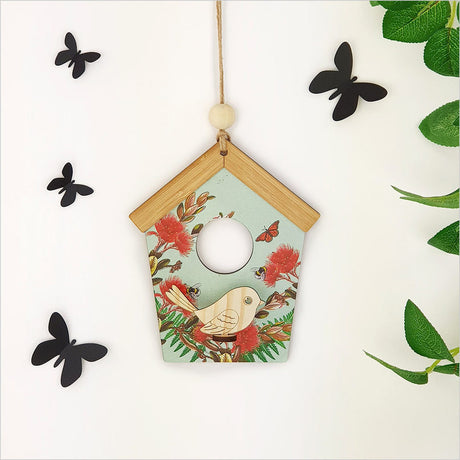 Birdhouse Wall Art featuring a laser-cut pine bird with vibrant green pohutukawa design, ideal for nature-inspired decor.