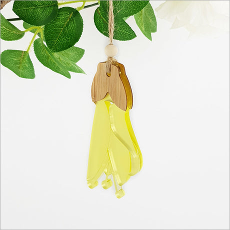 Kowhai Flower Bamboo ornament in yellow satin acrylic, elegantly crafted and ready to hang, measures 57mm x 114mm.