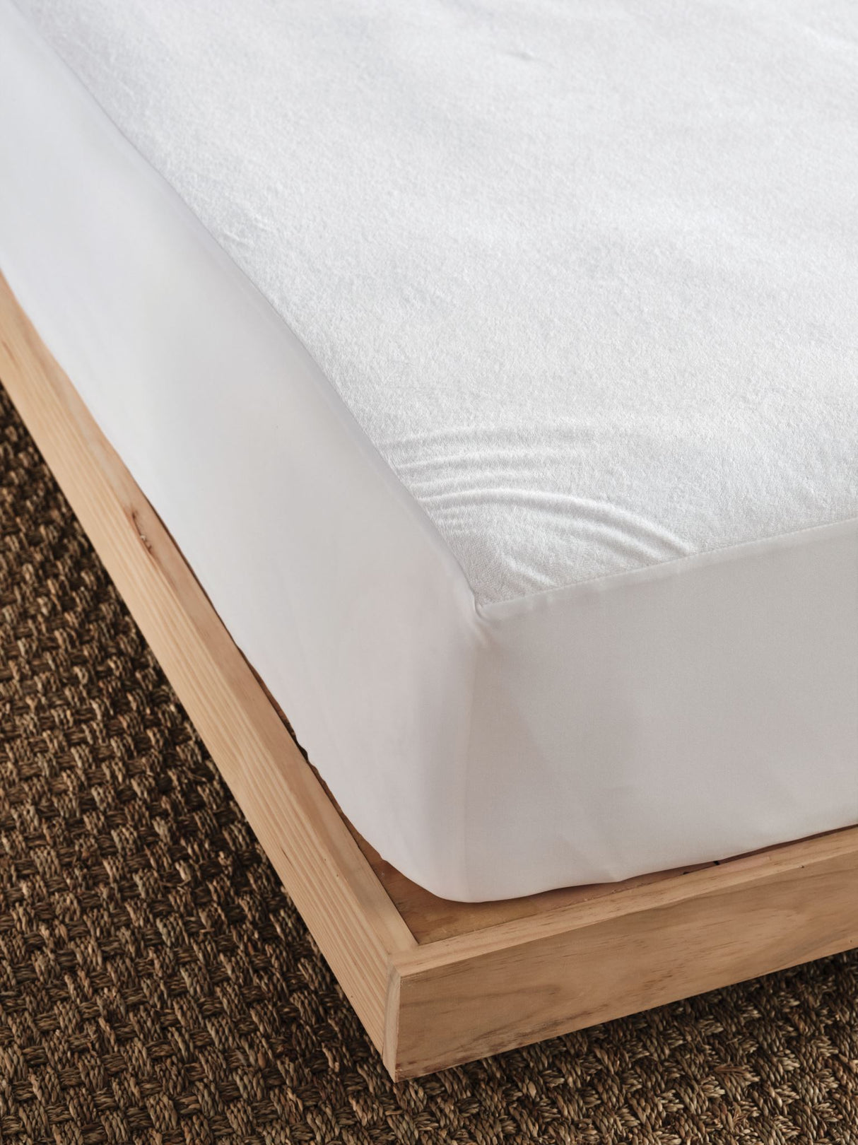 Everyday waterproof mattress protector with soft cotton terry surface and durable backing, fits single beds snugly.
