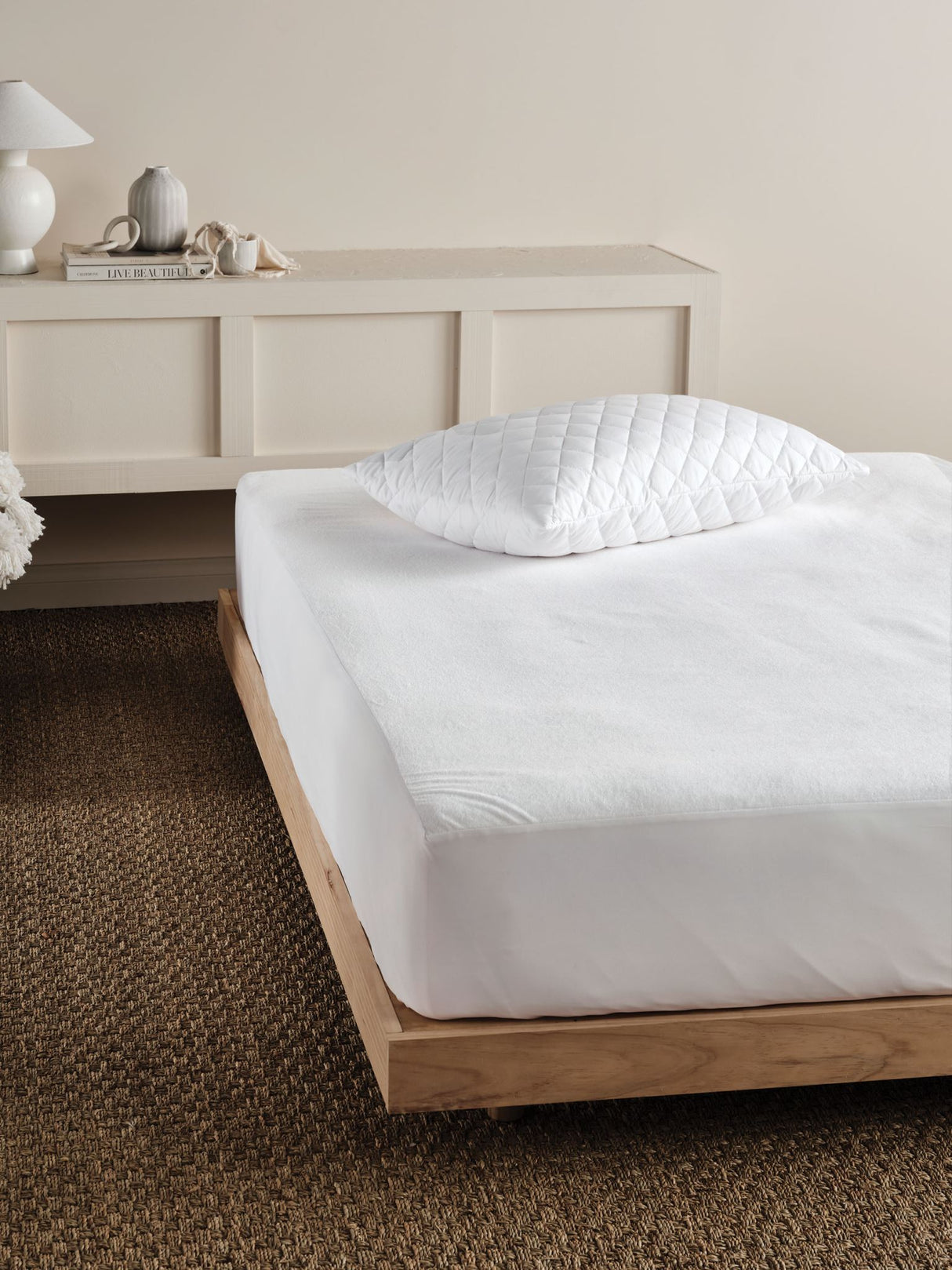 Everyday Waterproof Mattress Protector by Savona for queen beds, featuring soft cotton terry and waterproof backing to extend mattress life.