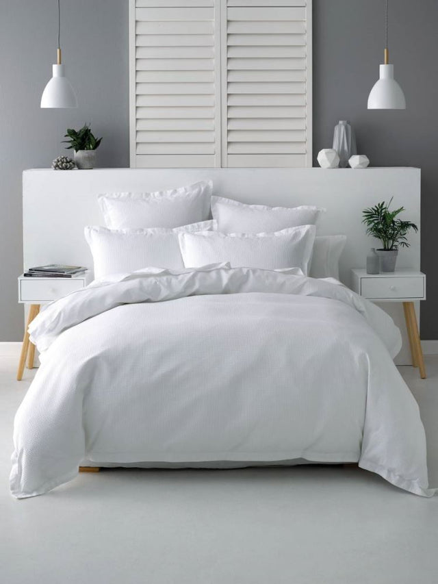 Elegant Nova White Single Duvet Set featuring 100% cotton waffle texture and matching pillowcase for a sophisticated bedroom look.