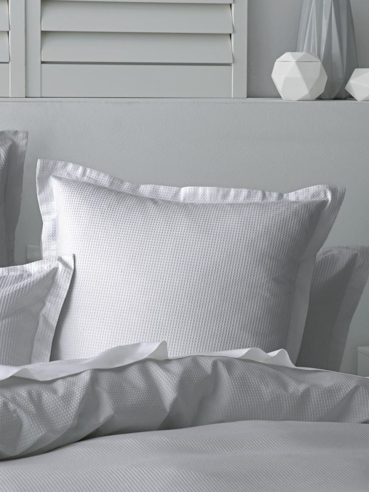 Nova Silver Duvet Set featuring a textured design, 100% cotton, waffle front, and tailored flange for elegance and comfort.