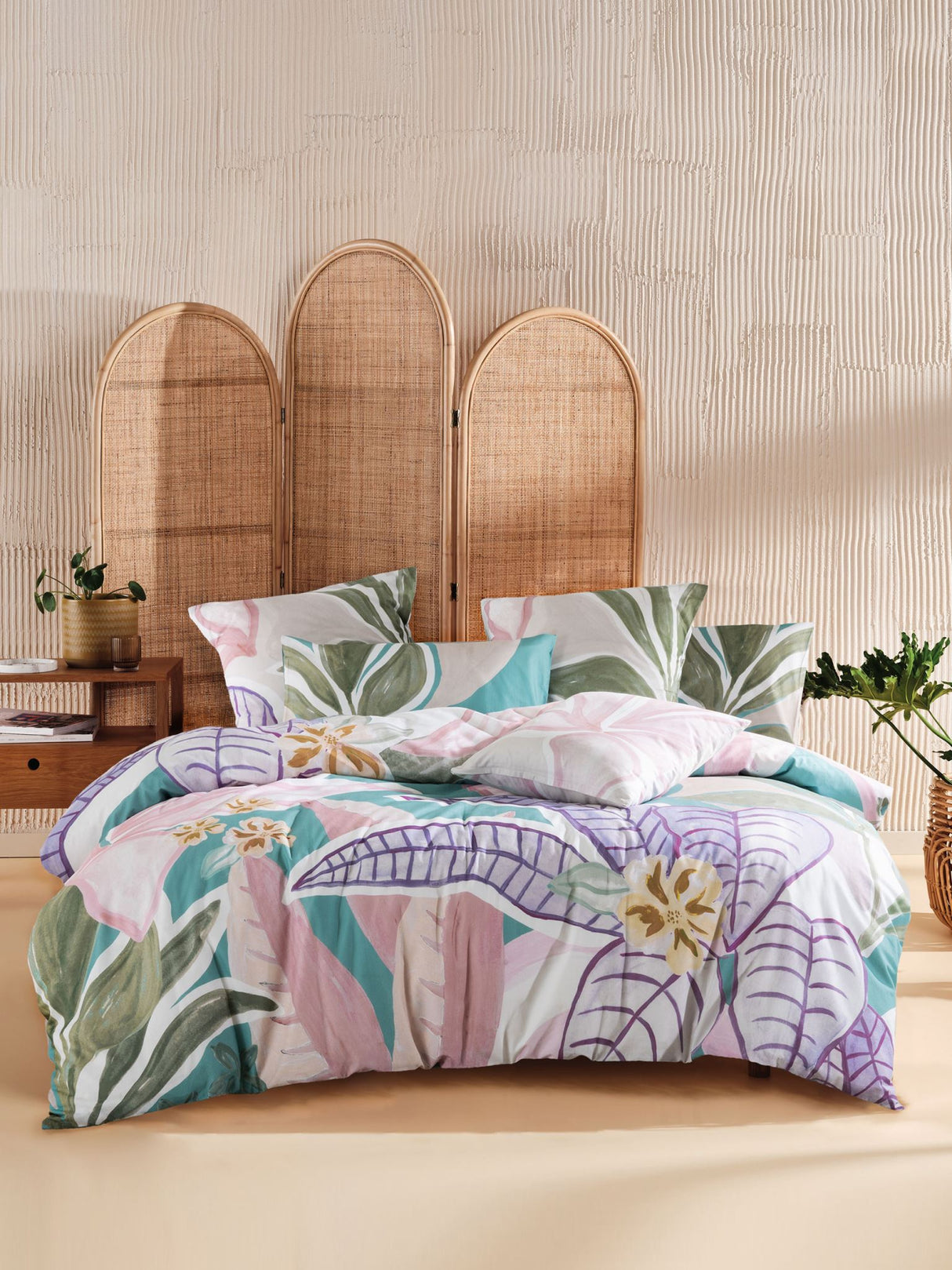 King duvet cover set featuring vibrant tropical foliage design on turquoise, crafted from 100% cotton sateen for comfort.