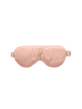 Blush silk sleep mask by Savona, designed for comfort and style, blocks light and protects delicate eye area.