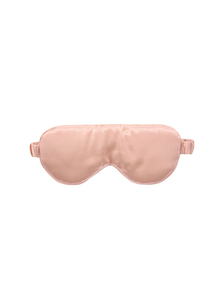 Blush silk sleep mask by Savona, designed for comfort and style, blocks light and protects delicate eye area.
