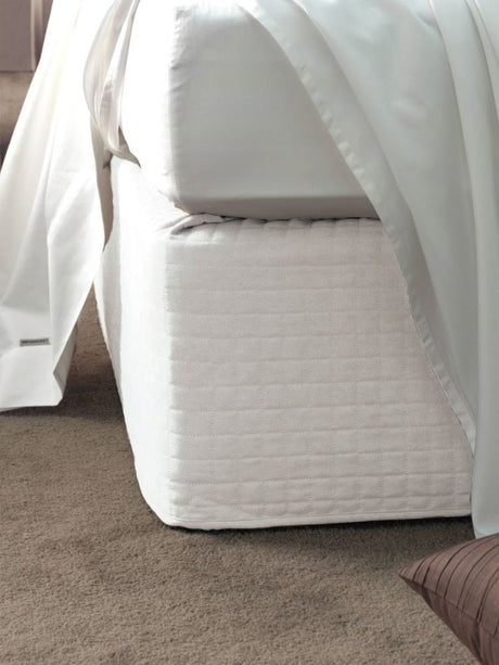 White suede quilted bedwrap for single beds, offering elegant style and easy maintenance.