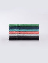 Luxurious Selene hand towel in Seaglass, made from soft 550 GSM cotton with elegant velour striped hem.