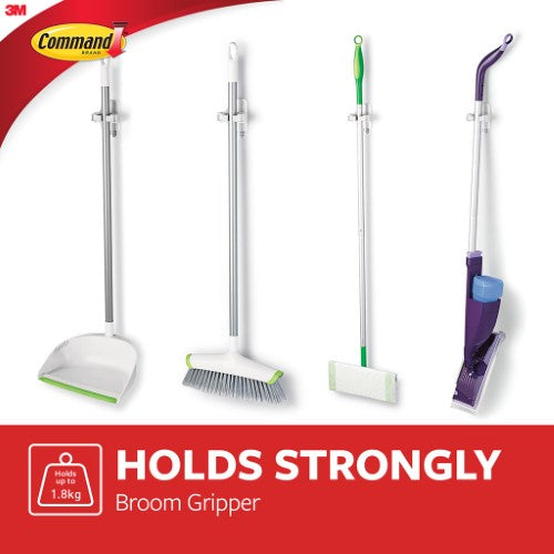 Command Broom Gripper 17007, a wall-mounted holder for mops and brooms, quick to install and removes cleanly without residue.