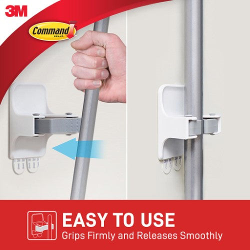 Command Broom Gripper 17007 hanging a broom, designed for tidy storage with no damage to walls or surfaces.