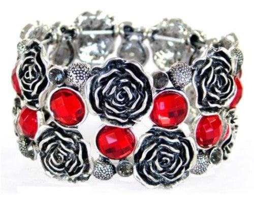 Antique silver finish bracelet with rose designs and vibrant red glass stones, elasticated for comfort.