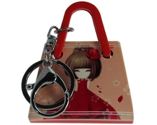 Acrylic key ring shaped like a handbag featuring a girl in a red dress, measuring 5.5cm W x 7.0cm H.