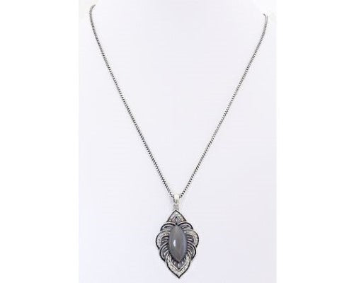 Elegant filigree necklace featuring a silver-grey catseye gemstone, perfect for layering or solo wear.