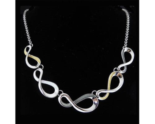 Rhodium plated infinity necklace with gold and grey silver enamel accents, symbolizing eternal love and elegance.