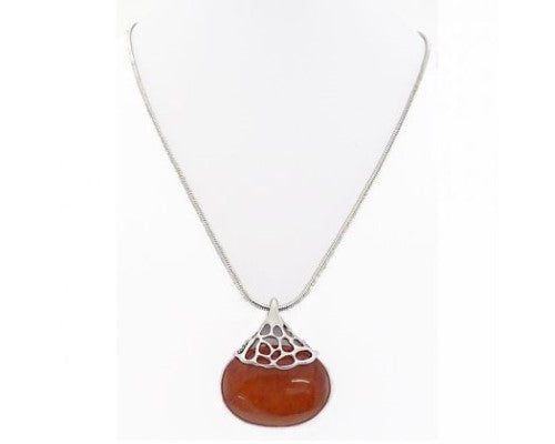 Burnt orange resin oval necklace with silver lace bail, perfect for vibrant casual or formal outfits.
