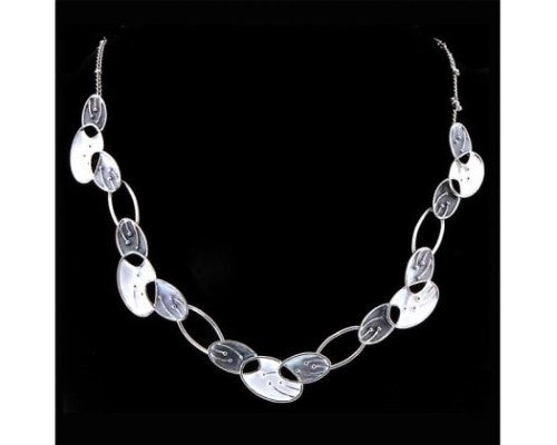 Rhodium plated necklace with oval leaf design in silver, features adjustable length and elegant shine, perfect for layering.