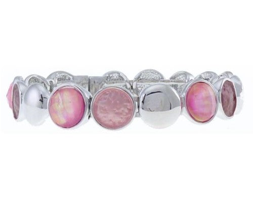 Silver bracelet featuring dark and light pink circles, perfect for adding elegance and color to any outfit.