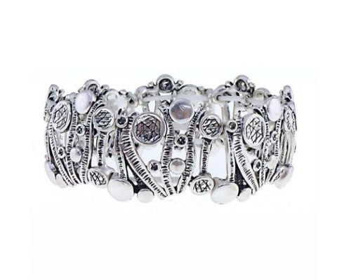 Antique silver bracelet featuring wavy bars and playful bobbles, perfect for adding elegance to any outfit.