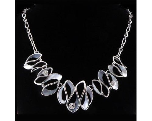 Elegant rhodium-plated silver necklace featuring a delicate ribbon design, 46cm length with extension for perfect fit.
