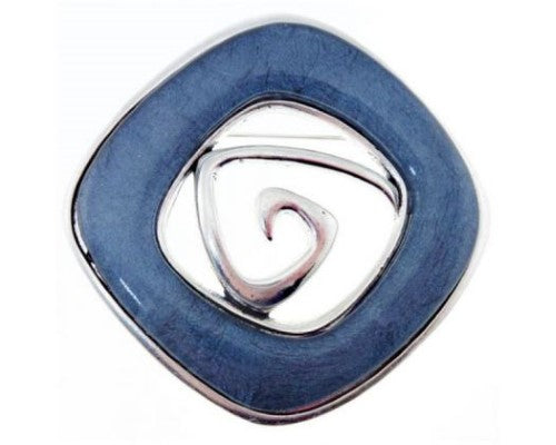 Antique silver brooch with blue resin inlay, 6cm diameter, combining elegance and sophistication for any outfit.