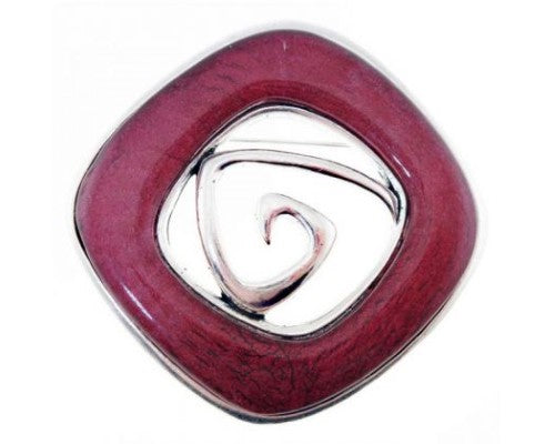 Antique silver brooch featuring dark red resin centerpiece, 6cm diameter, perfect for elevating any outfit.