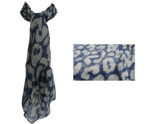 Luxurious sheer navy scarf with charming grey puffs, perfect for stylish layering and enhancing any outfit.