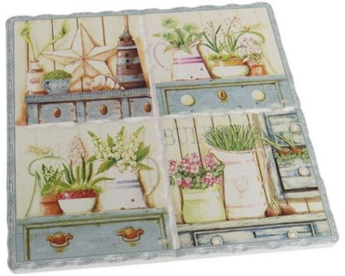 Cork-backed ceramic trivet featuring a decorative lavender garden theme, measuring 15.5 cm x 16 cm.