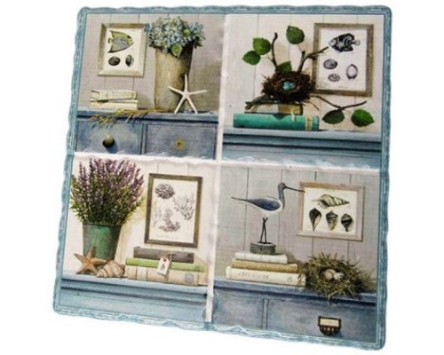 Ceramic trivet featuring marine motifs, cork-backed for durability, measuring 15.5 cm x 16 cm, adds coastal charm to any kitchen.