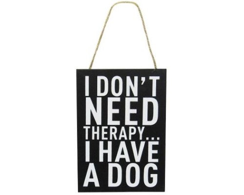 Charming word art featuring 'I don't need therapy, I have a dog' with playful pawprints, perfect for dog lovers.