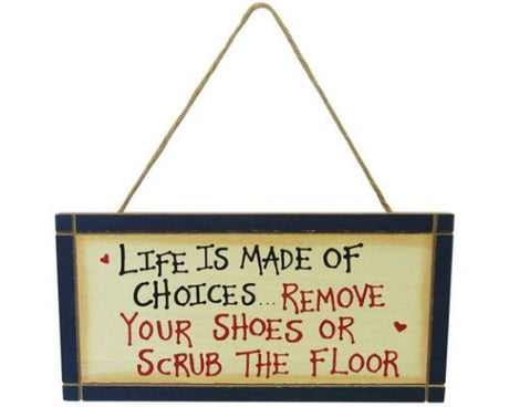 Rustic wall art sign featuring 'Life is made of choices, remove your shoes or scrub the floor', 24 x 12 cm with rope hanger.