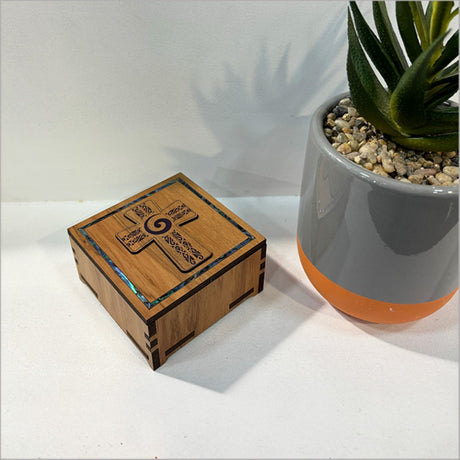 Elegant small trinket box with paua inlay, inspired by koru design, perfect for storing jewelry and keepsakes.