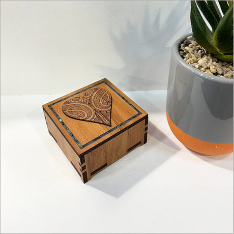 Small heart-shaped trinket box with Paua inlay, handcrafted from NZ veneer, perfect for storing jewelry and keepsakes.