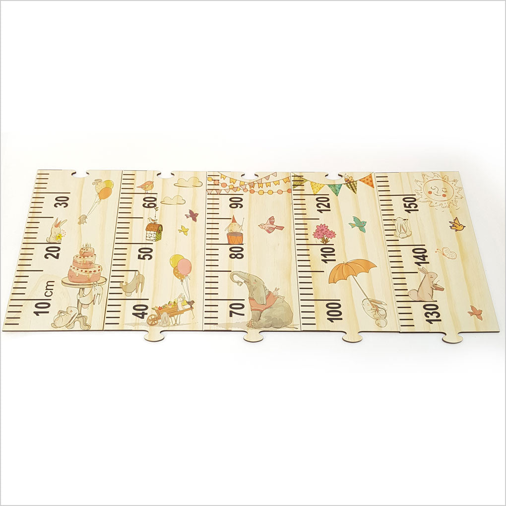 Woodland Party Growth Chart Ruler in eco-friendly pine veneer featuring charming animals and customizable puzzle pieces.