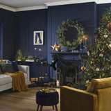 Luxurious green velvet Christmas stocking with gold star charm, 42cm x 25cm, perfect for festive decor and reuse.