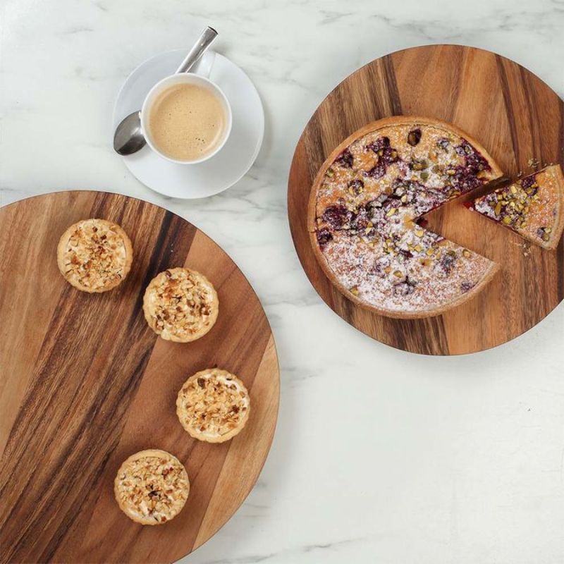 Large Baroque-style revolving platter made of rustic acacia wood, perfect for serving appetizers and condiments elegantly.