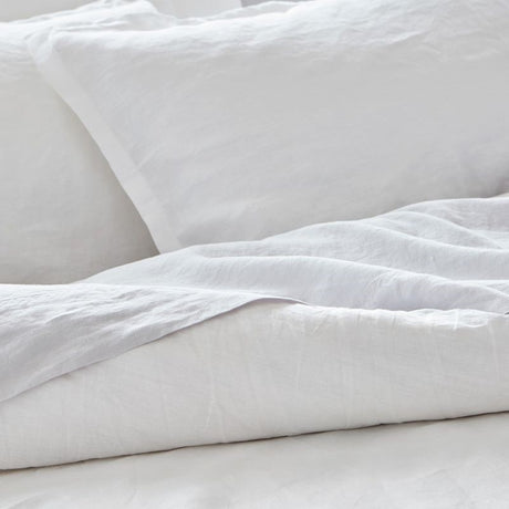 Luxurious BAKSANA linen sheet set in white for California King beds, made from eco-friendly, soft European Latvian linen.