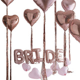 Rose gold bride balloon kit with heart balloons for hen party decorations and celebration setup.