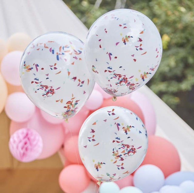 Double layered white balloons with vibrant rainbow confetti, ideal for festive celebrations and party decor.