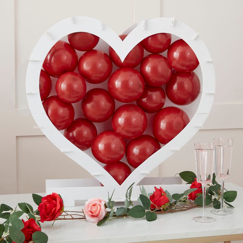 Heart-shaped balloon mosaic stand for romantic celebrations, easy to assemble, eco-friendly, and perfect for centerpieces.