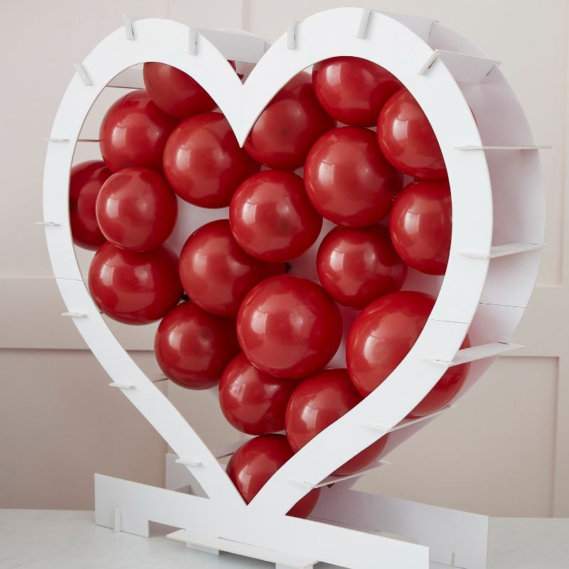 Heart-shaped balloon mosaic stand for romantic celebrations, easy assembly, eco-friendly design, and customizable with balloons.