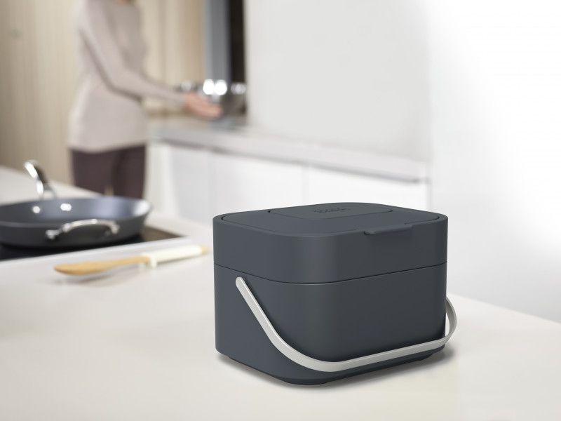 Joseph Joseph Stack 4 in Graphite, a stylish food waste caddy with ventilation and odor filter, perfect for eco-friendly kitchens.