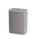 Joseph Joseph Tota 90-litre laundry basket in grey with dual compartments for lights and darks, featuring removable tote bags.